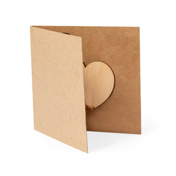 Cuore in legno naturale con semi di fiori selvatici