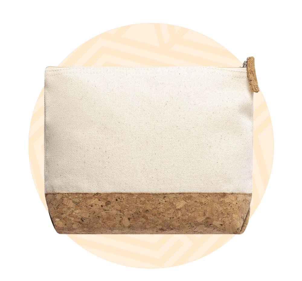 Beauty case in cotone con base in sughero. Background composto da un cerchio arancione.